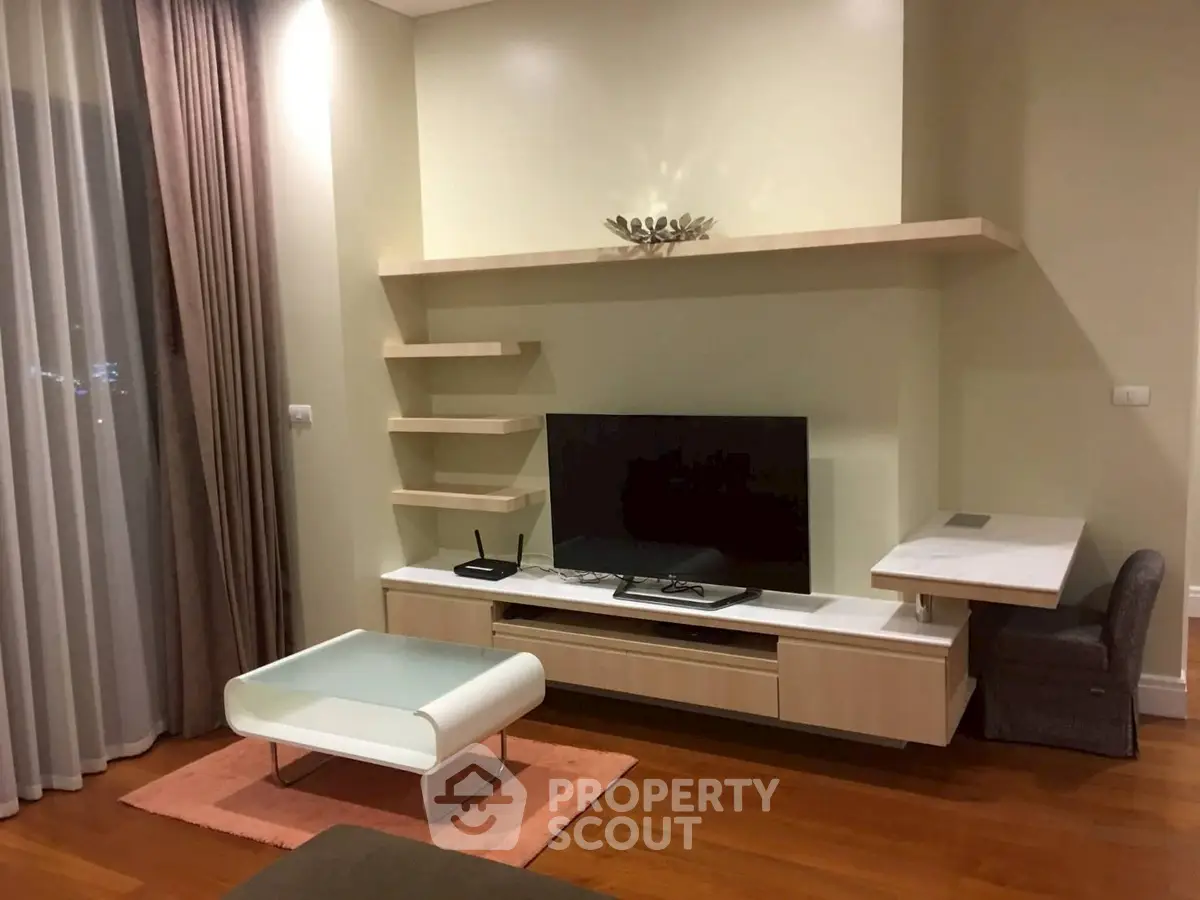 Modern living room with sleek TV unit and stylish shelving