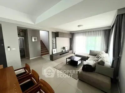 Spacious modern living room with elegant decor and natural light