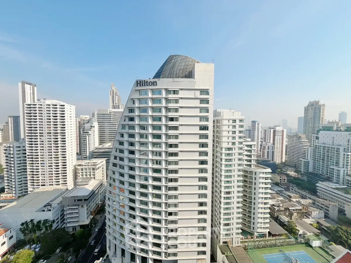 Stunning high-rise building with modern architecture and cityscape views, perfect for urban living.