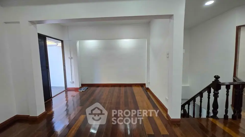 Spacious interior with polished wooden floors and open layout