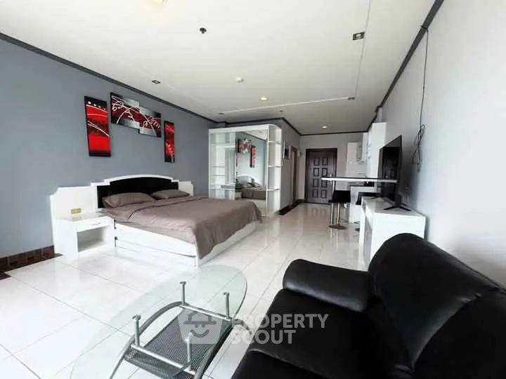 Spacious modern bedroom with sleek furniture and stylish decor