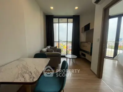 Modern living room with balcony view and stylish furniture