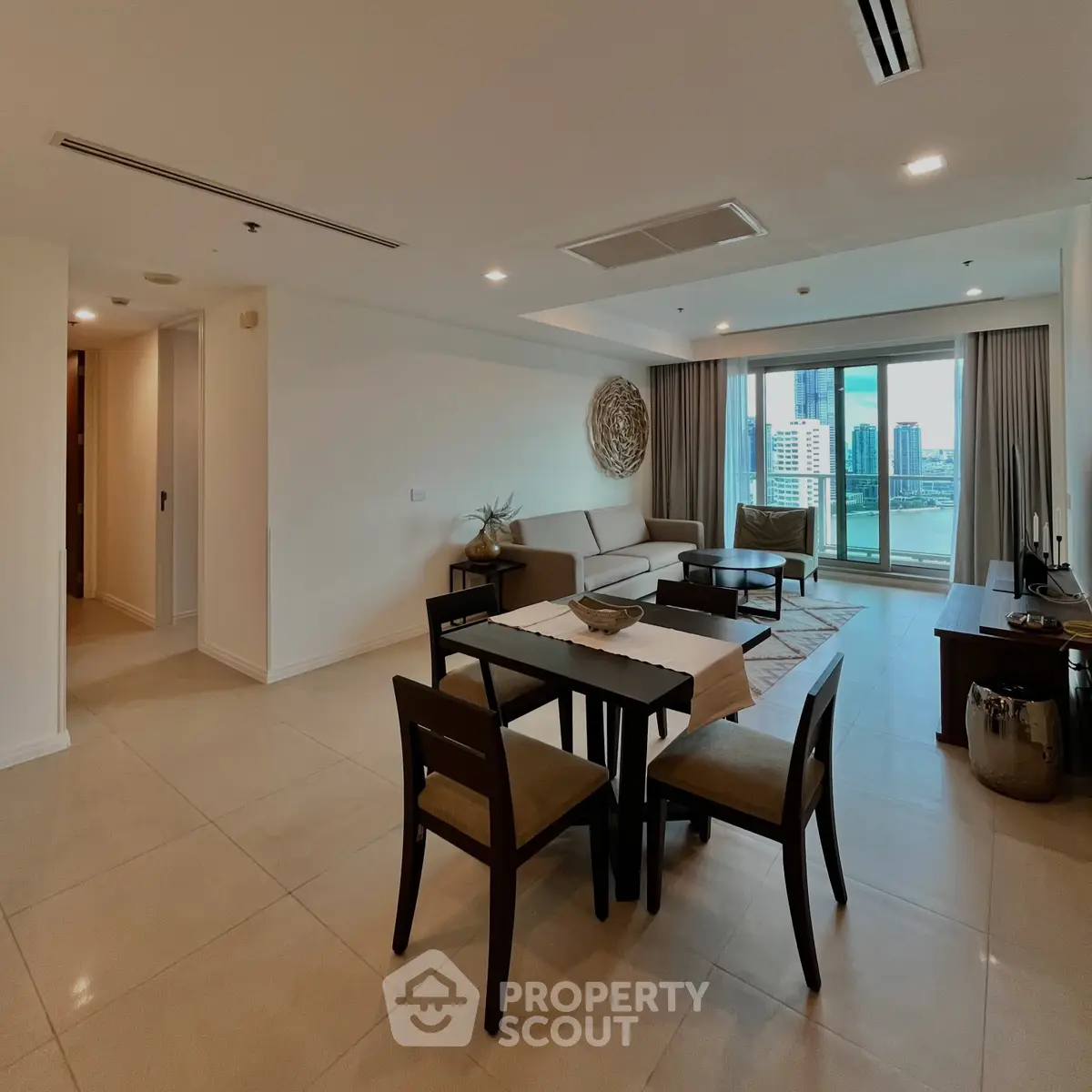 Spacious modern living room with elegant decor and city view balcony