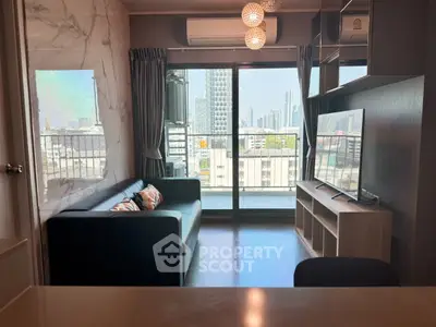 Modern living room with city view, featuring sleek furniture and large windows for natural light.