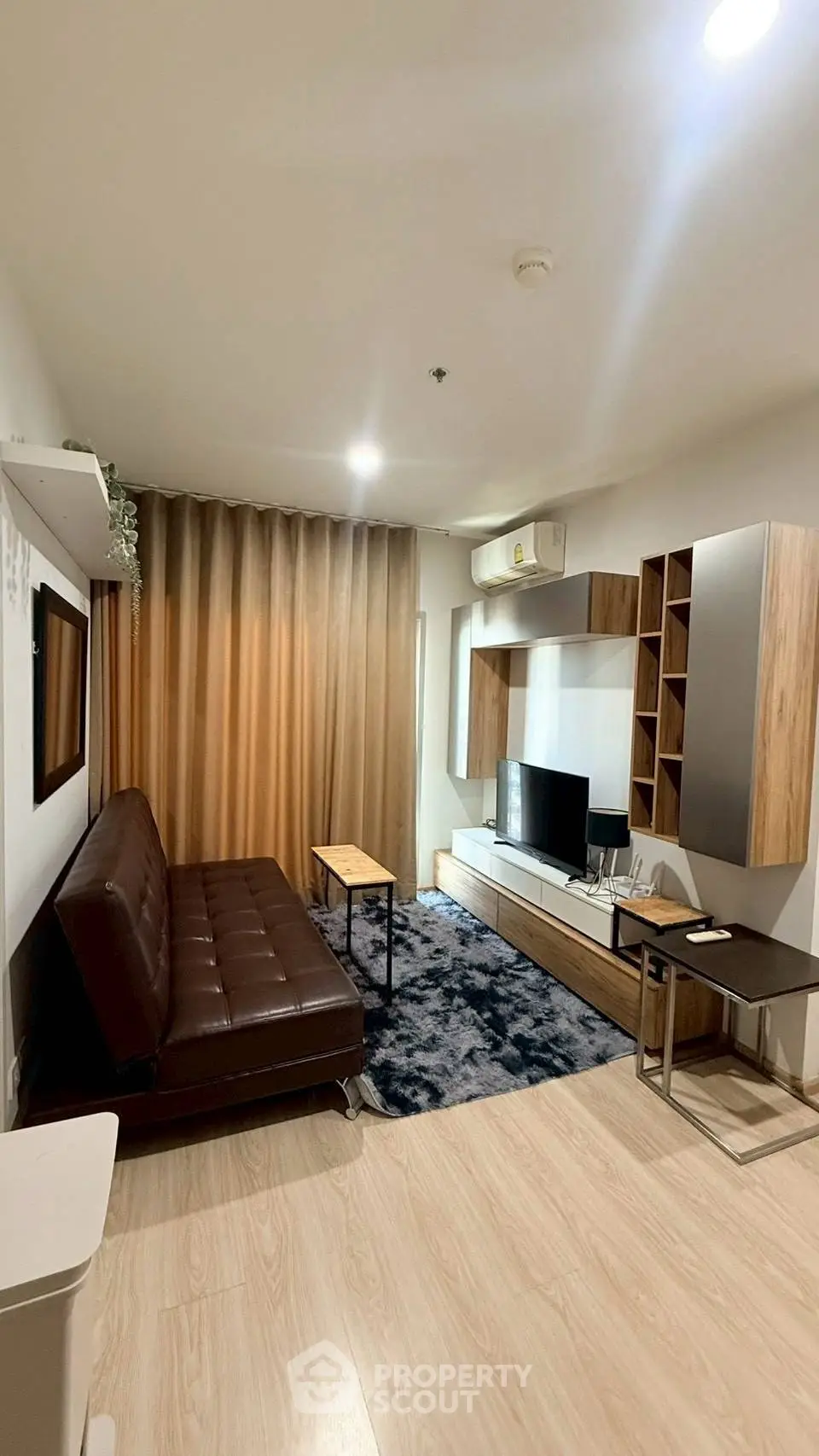 Modern living room with stylish furniture and cozy ambiance in a contemporary apartment.