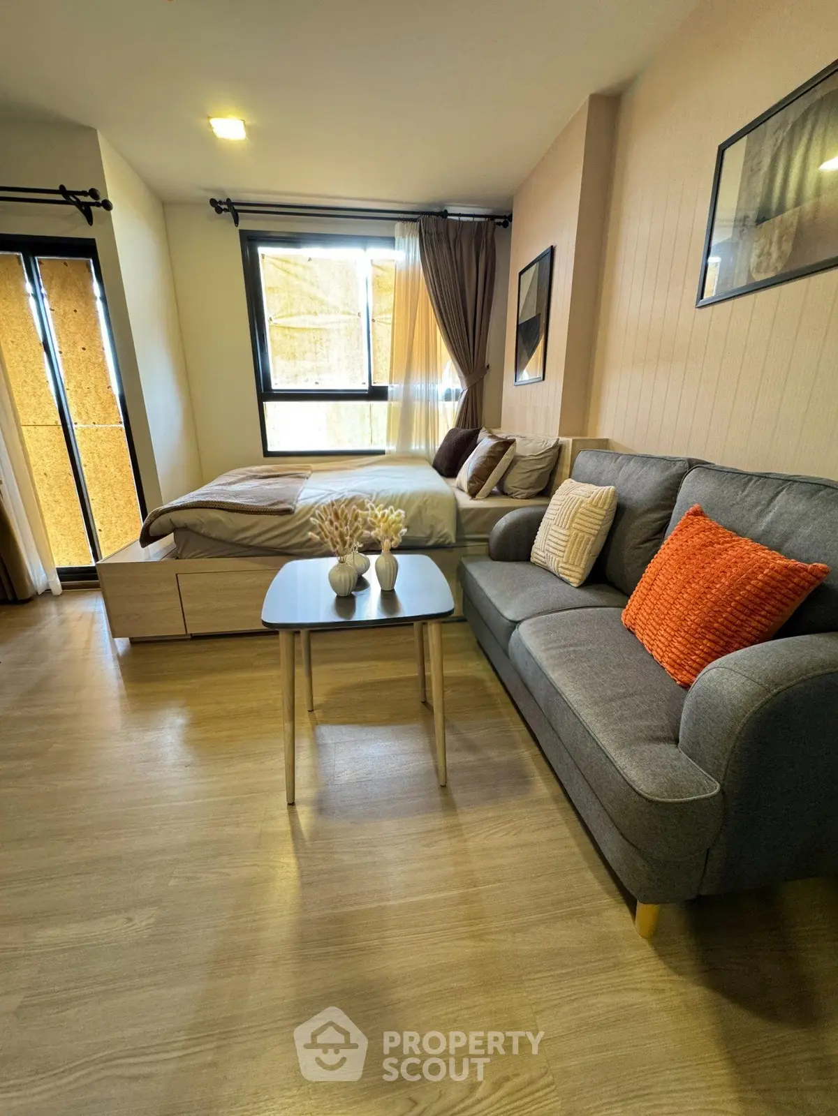 Modern studio apartment with cozy living area and stylish decor