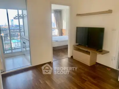 Modern apartment interior with wooden flooring and balcony view