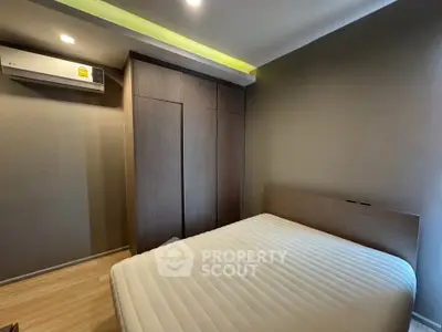 Modern bedroom with sleek design and built-in wardrobe