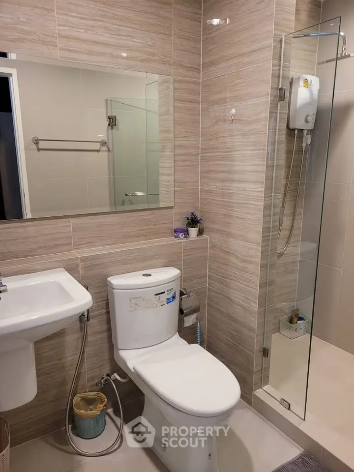 Modern bathroom with glass shower and sleek fixtures