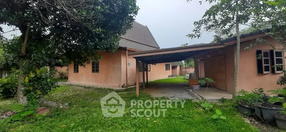 Charming countryside home with lush garden and spacious outdoor area.