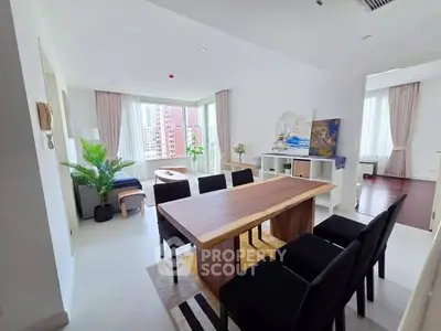 Spacious modern dining area with natural light and city view, perfect for entertaining.