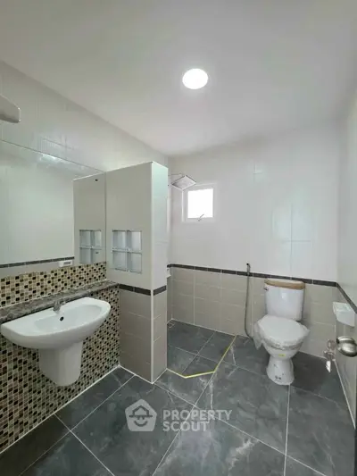 Modern bathroom with stylish tile design and sleek fixtures