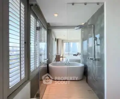 Luxurious bathroom with modern bathtub and city view