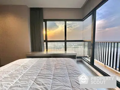 Stunning bedroom with panoramic window views and modern design.