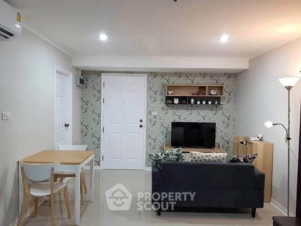 Modern living room with stylish decor and cozy seating area, perfect for relaxation and entertainment.