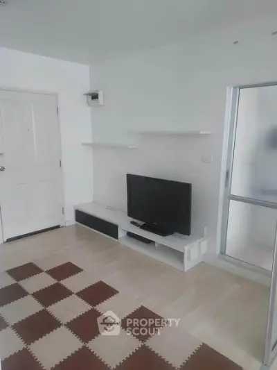 Modern living room with minimalist decor and sleek TV setup
