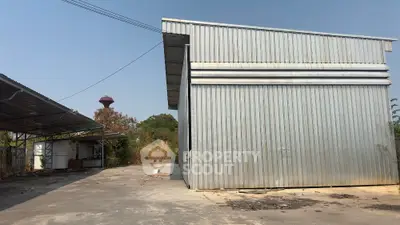 Spacious industrial warehouse with ample outdoor space for storage and operations.