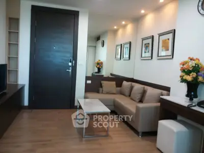 Modern living room with stylish decor, cozy sofa, and elegant lighting in a contemporary apartment.