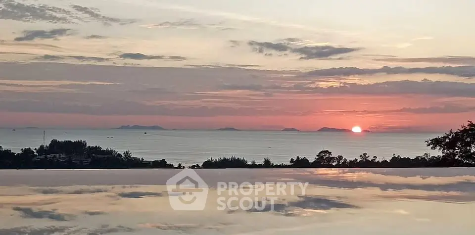 Stunning ocean view from infinity pool at sunset, perfect for luxury living.
