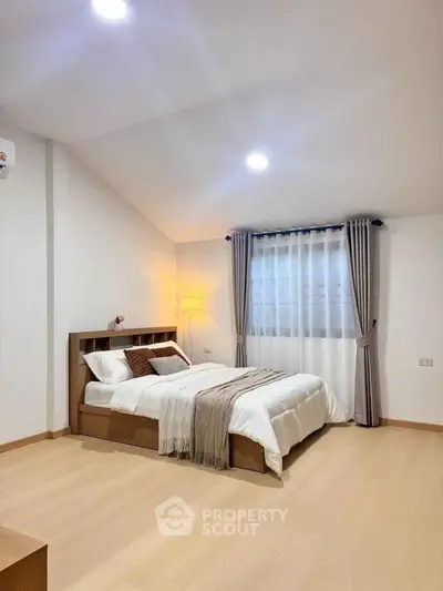 Cozy and modern bedroom with elegant decor and natural light