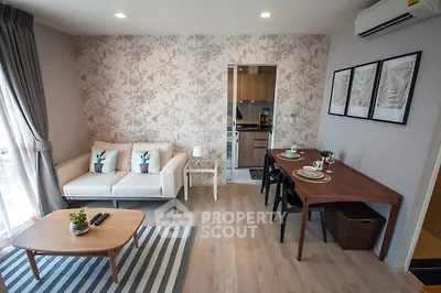 Stylish living room with modern decor and open layout in a cozy apartment.