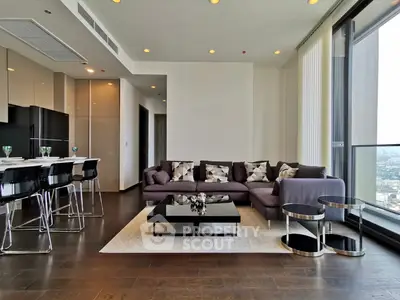 Modern living room with sleek furniture and panoramic city view