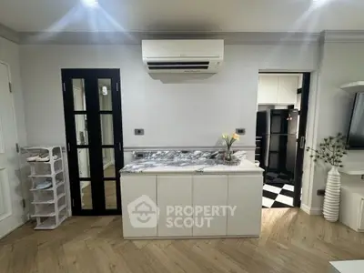 Modern interior with marble countertop and air conditioning unit