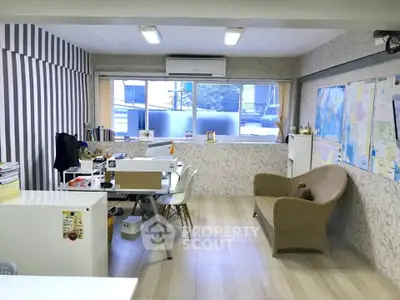 Spacious office space with modern decor and natural light, ideal for productivity and comfort.