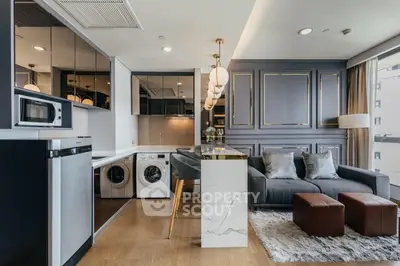 Luxurious modern living room with integrated kitchen and laundry appliances, featuring elegant decor and ample natural light.