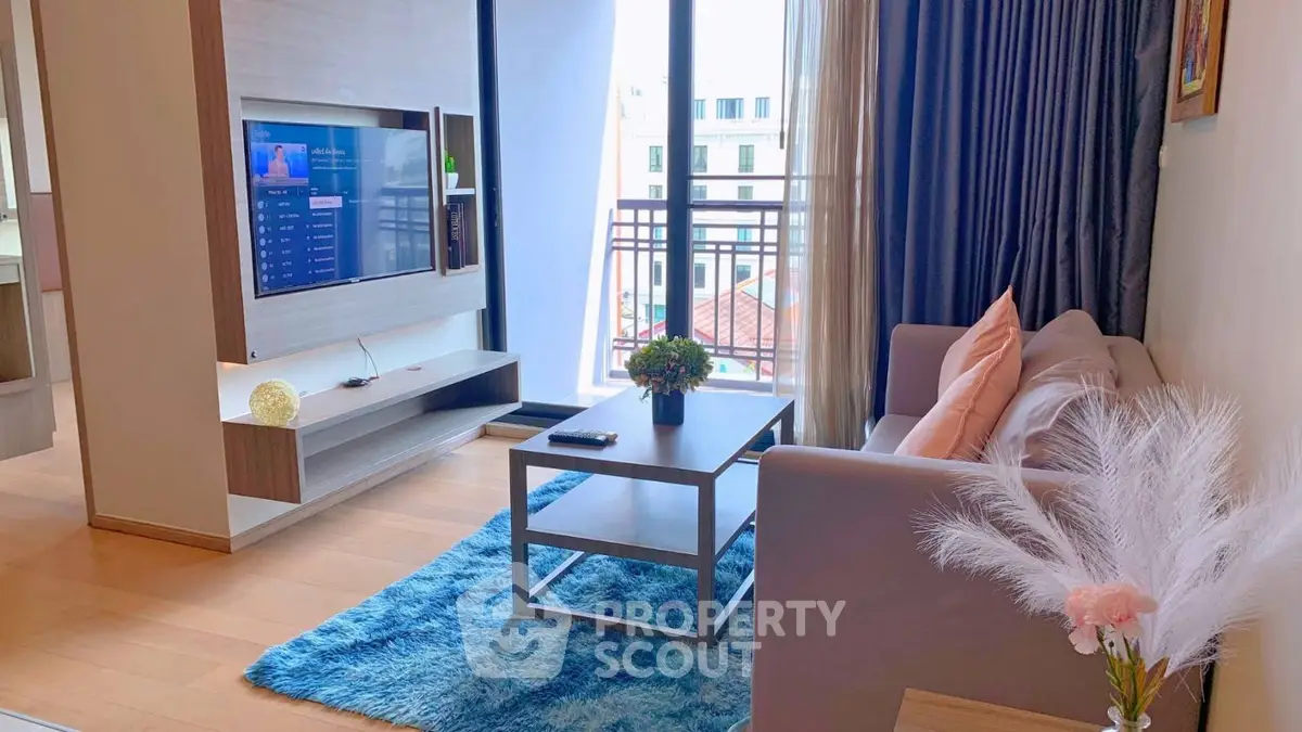 Modern living room with stylish decor and large window view