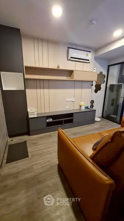 Modern living room with sleek design and air conditioning unit