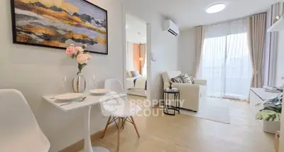 Modern open-plan living room with dining area and natural light