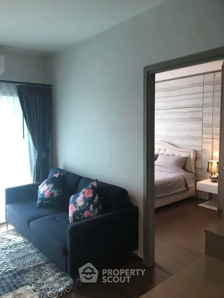 Modern apartment interior with cozy living room and elegant bedroom, featuring stylish decor and natural light.