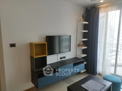 Modern living room with stylish TV unit and balcony view