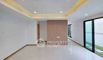 Spacious modern living room with sleek design and ample natural light