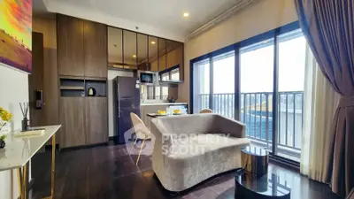 Modern living room with open kitchen and balcony view in luxury apartment