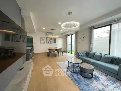 Spacious modern living room with elegant decor and large windows