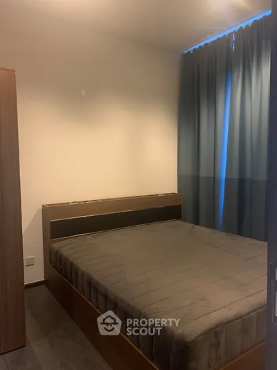 Cozy bedroom with modern furnishings and soft lighting, perfect for relaxation and comfort.