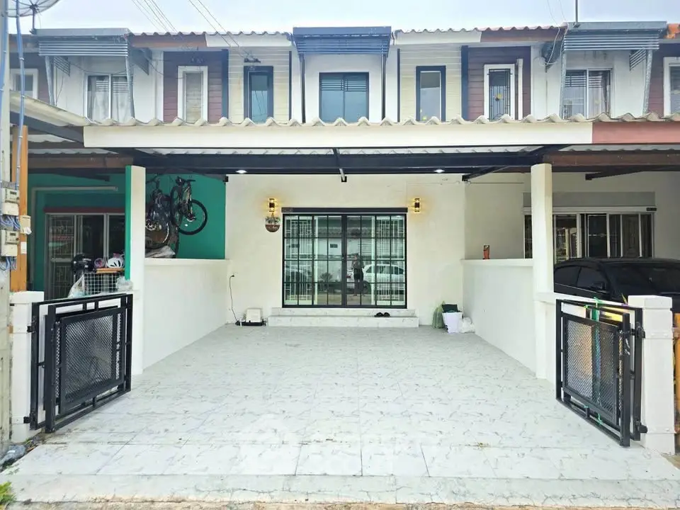 Charming townhouse with spacious front patio and modern facade