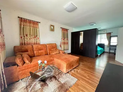 Spacious living room with modern furniture and wooden flooring