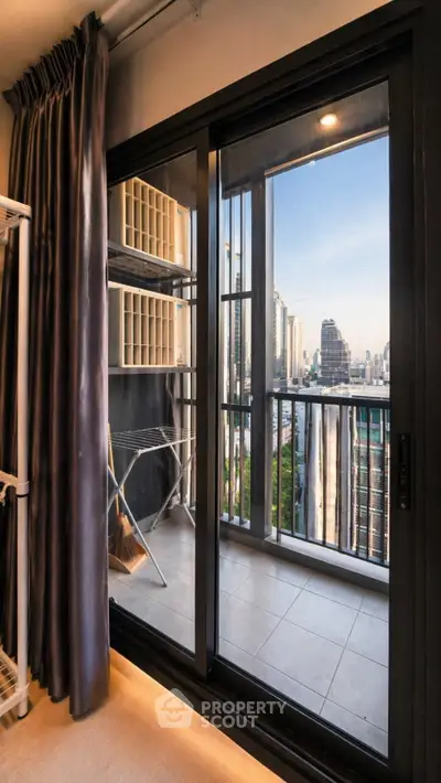 Modern apartment balcony with stunning city view and sliding glass doors