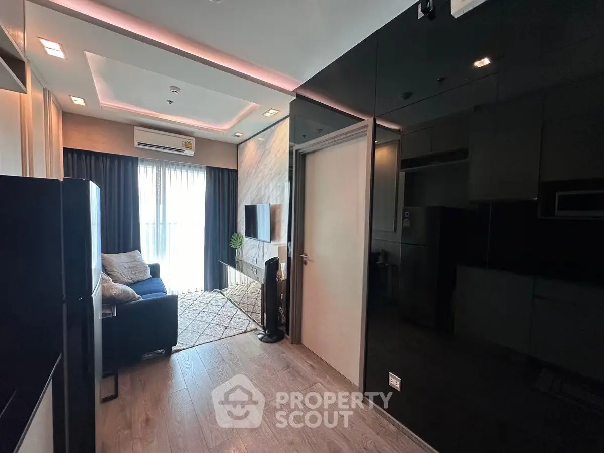 Modern living room with sleek design and natural light, featuring a cozy sofa and stylish decor.