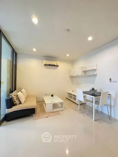 Modern living room with sleek furniture and bright lighting