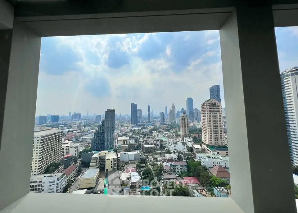Stunning cityscape view from high-rise building window in urban skyline.