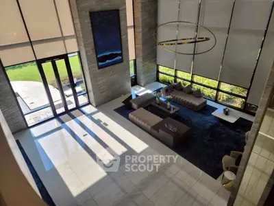 Luxurious modern living room with high ceilings and elegant decor