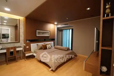 Luxurious modern bedroom with elegant decor and balcony access