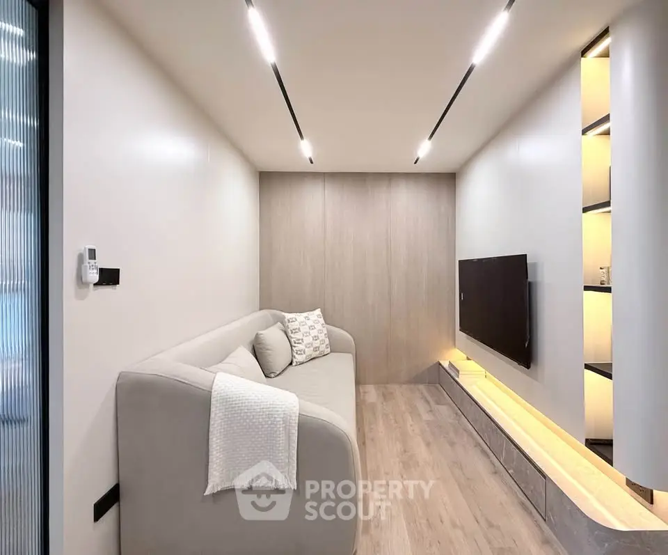 Modern minimalist living room with sleek design and cozy sofa