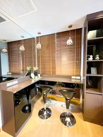 Modern kitchen with sleek bar stools and stylish wooden blinds