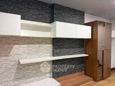 Modern interior with stylish shelving and wood accents in a contemporary living space.