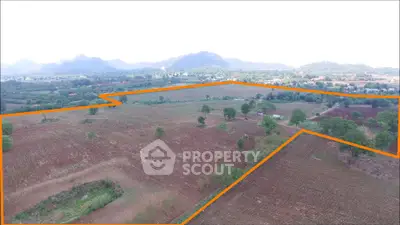 Expansive land plot with scenic mountain views, ideal for development or agriculture.